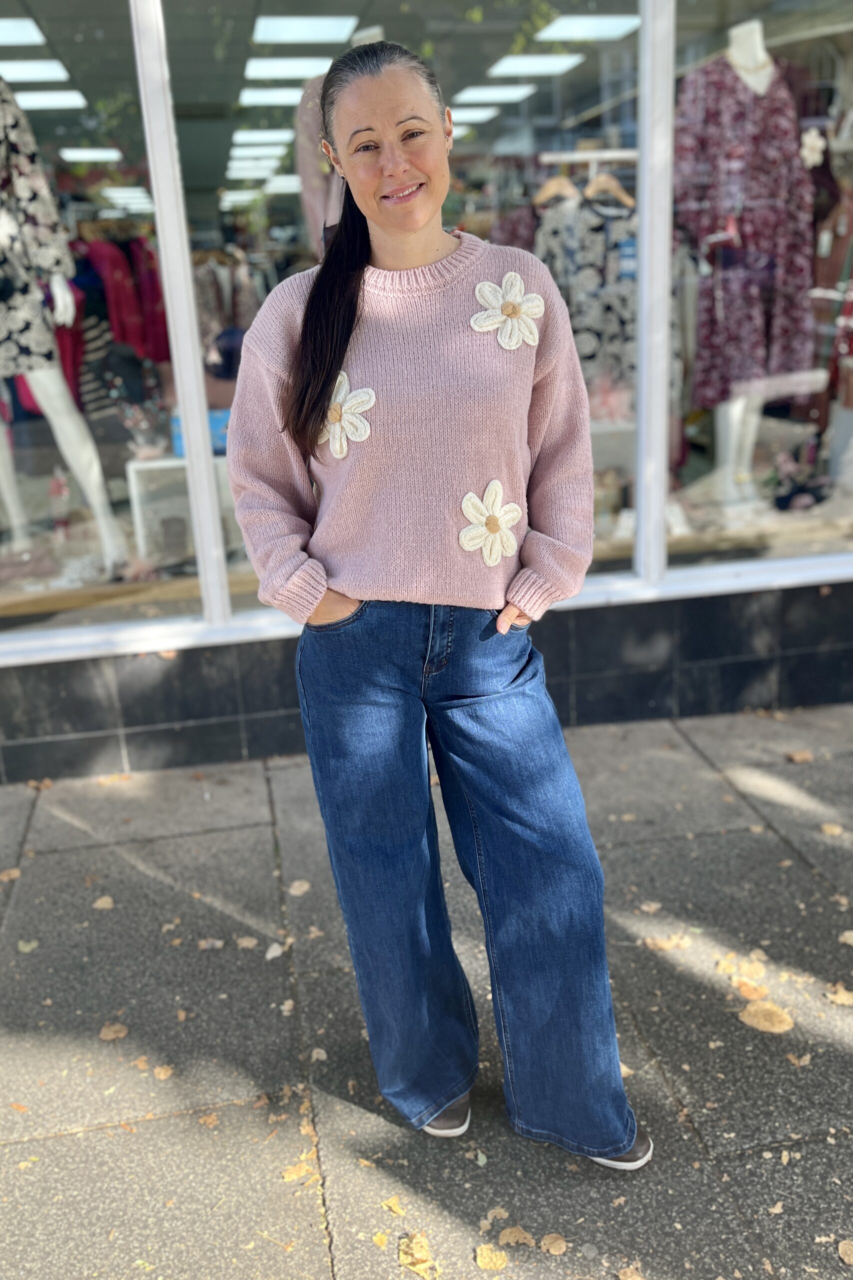 Clathers Shop, Minehead, Davina wearing the daisy jumper and wide leg jeans from clathers.