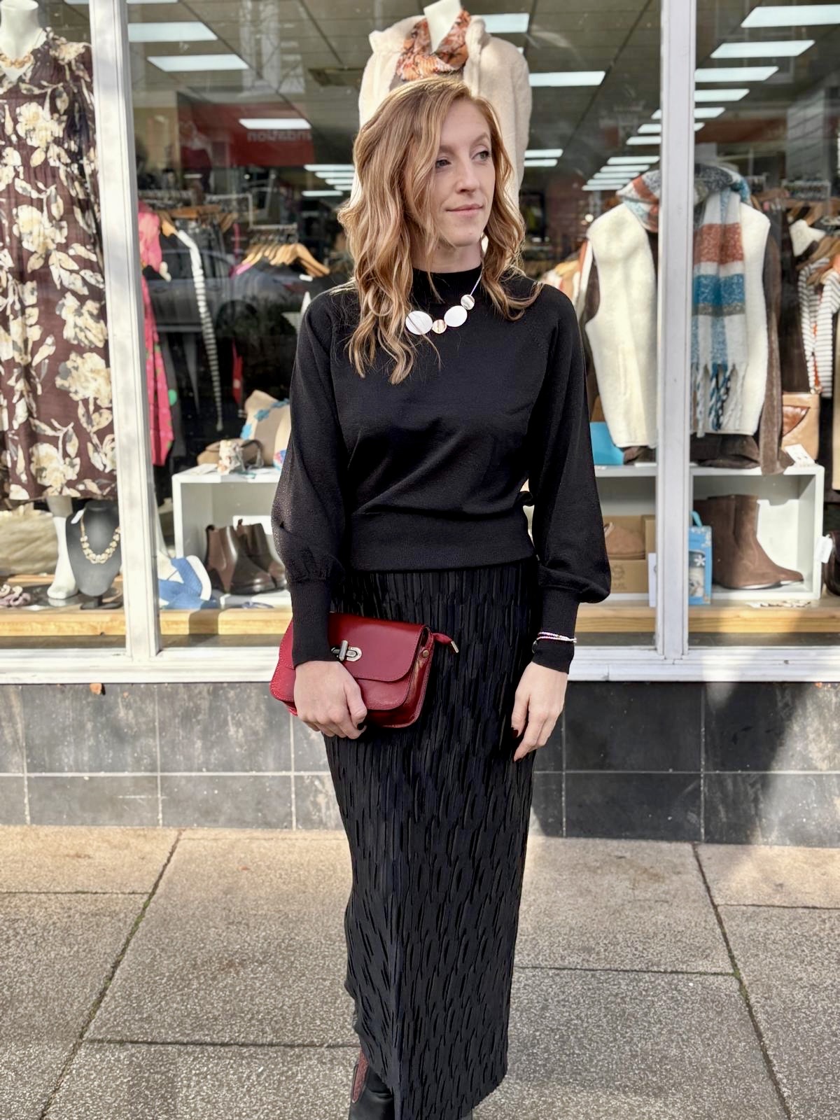 Shop The Look - Clathers Minehead - Black christmas party outfit - High neck shimmer jumper, shirred midi skirt, and red leather cross body bag